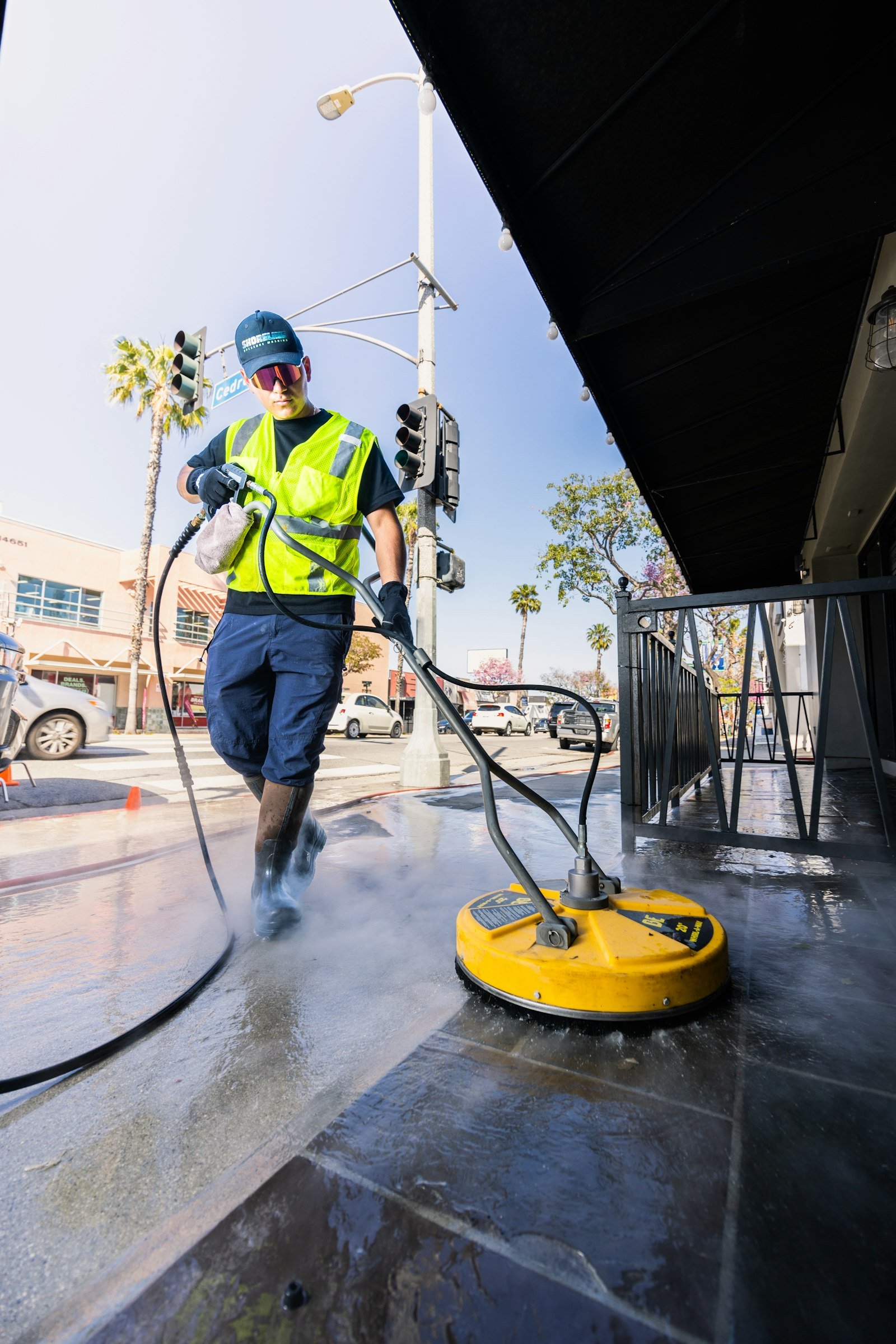 Commercial pressure washing of a storefront sidewalk