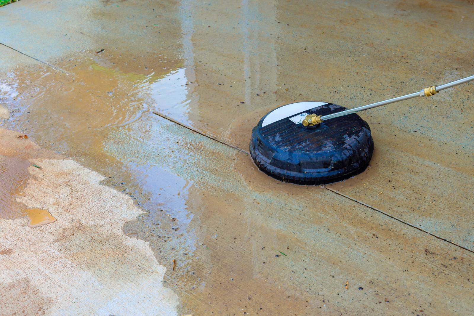 Surface cleaner running across a concrete slab