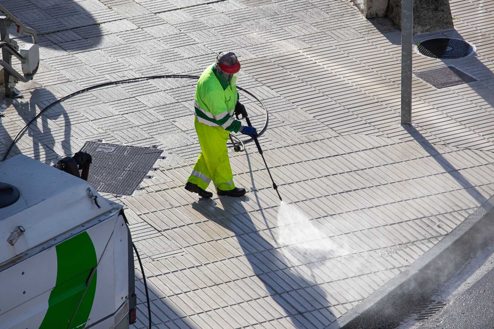 Commercial pavement being pressure washed